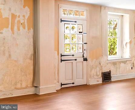 3577 Olde Bedminster Rd, Ottsville, PA 18942 - doorway to outside with wood finished floors and baseboards