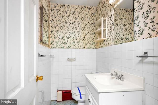 3577 Olde Bedminster Rd, Ottsville, PA 18942 - bathroom with wallpapered walls, tile walls, toilet, vanity, and a wainscoted wall