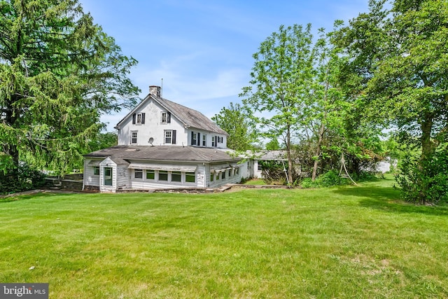 3577 Olde Bedminster Rd, Ottsville, PA 18942 - back of property featuring a chimney, a lawn, and a shingled roof