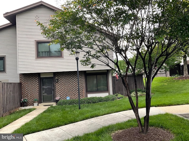 view of property featuring brick siding