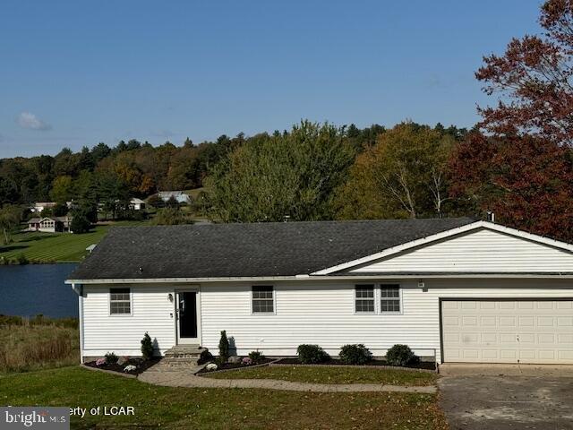 279 Apache Dr, Shickshinny, PA 18655 - single story home featuring a garage, concrete driveway, a front lawn, and entry steps