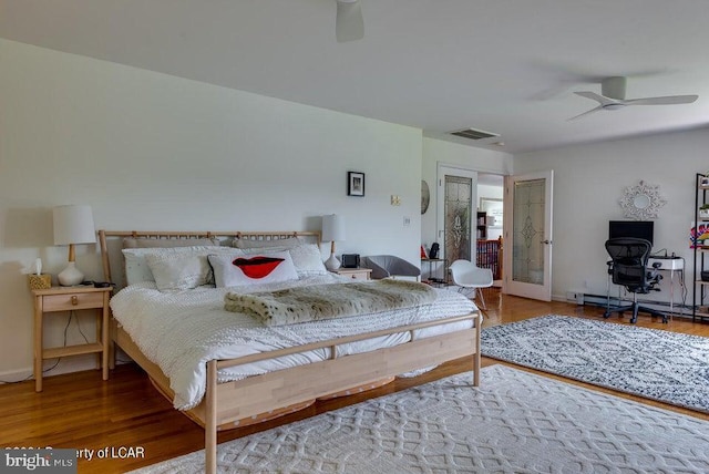 279 Apache Dr, Shickshinny, PA 18655 - bedroom featuring wood finished floors, an office area, and a ceiling fan
