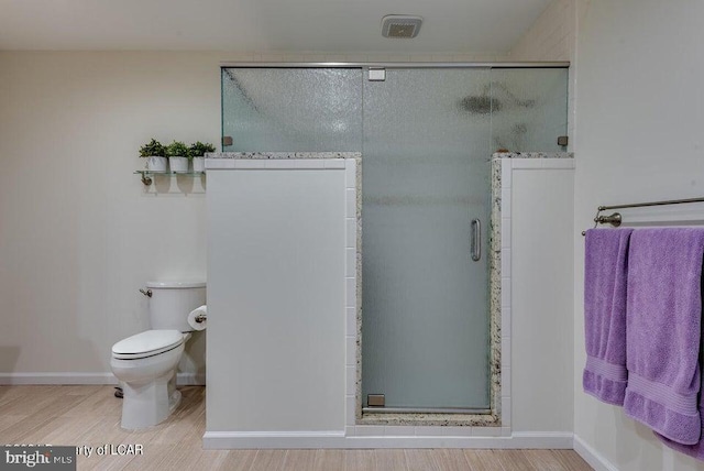 279 Apache Dr, Shickshinny, PA 18655 - bathroom with toilet, a stall shower, and baseboards