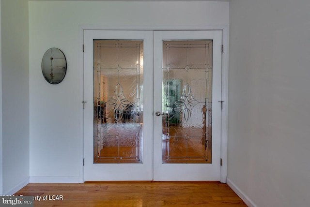 279 Apache Dr, Shickshinny, PA 18655 - entryway featuring french doors, wood finished floors, and baseboards