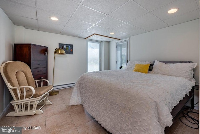 279 Apache Dr, Shickshinny, PA 18655 - bedroom featuring a baseboard heating unit, a paneled ceiling, light tile patterned floors, and recessed lighting