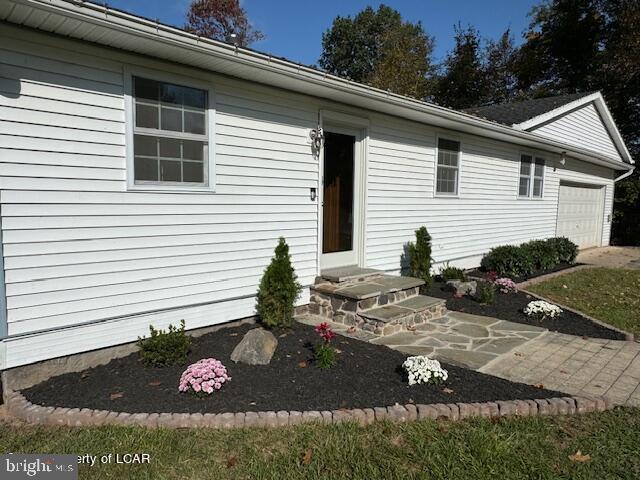 279 Apache Dr, Shickshinny, PA 18655 - view of exterior entry featuring a garage