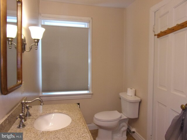 142 Fawn Rd, Reedsville, PA 17084 - bathroom featuring toilet, vanity, and baseboards