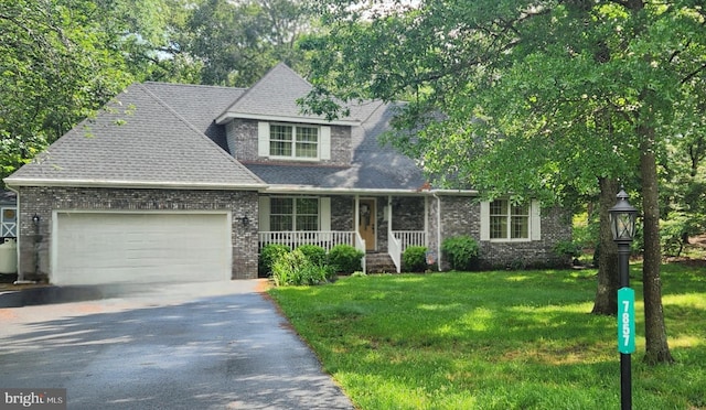 7857 Holly Branch Dr, Laurel, DE 19956 - view of front of home featuring a porch, an attached garage, driveway, a front yard, and brick siding
