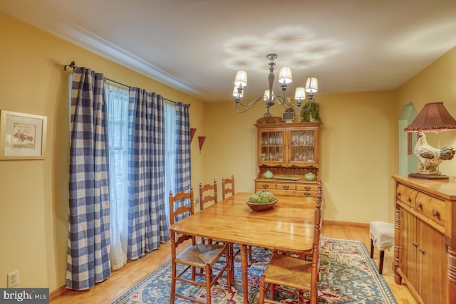 7857 Holly Branch Dr, Laurel, DE 19956 - dining space featuring light wood-type flooring and a chandelier