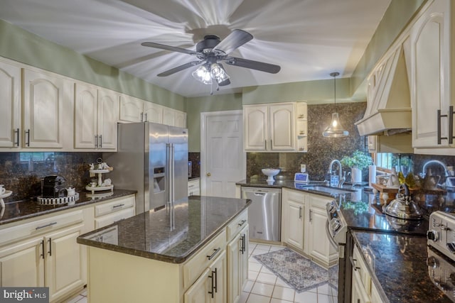 7857 Holly Branch Dr, Laurel, DE 19956 - kitchen featuring stainless steel appliances, a ceiling fan, a sink, tasteful backsplash, and light tile patterned floors