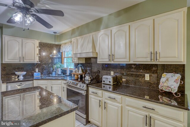 7857 Holly Branch Dr, Laurel, DE 19956 - kitchen featuring stainless steel range with electric cooktop, a sink, premium range hood, and dark stone counters