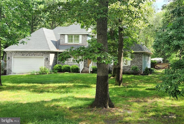 7857 Holly Branch Dr, Laurel, DE 19956 - view of front of house with an attached garage, brick siding, a front lawn, and a porch