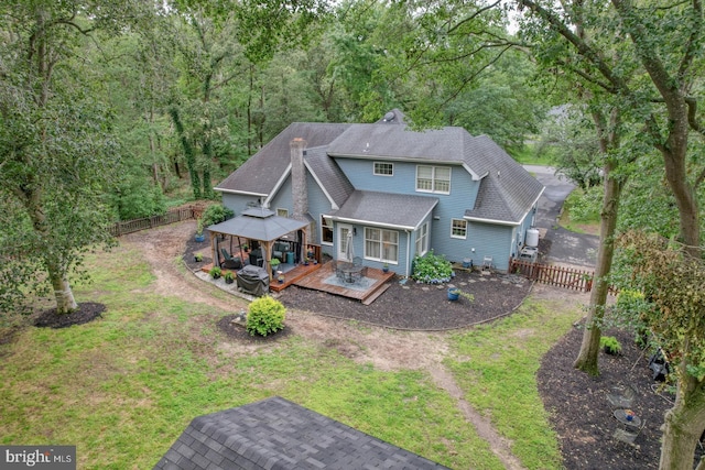 7857 Holly Branch Dr, Laurel, DE 19956 - rear view of house featuring a gazebo, a deck, a forest view, and roof with shingles