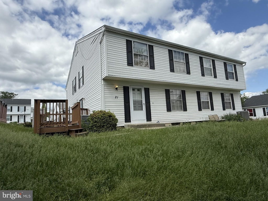 21 Ewing Dr Unit C, Reisterstown, MD 21136 - colonial home featuring a wooden deck and central AC unit