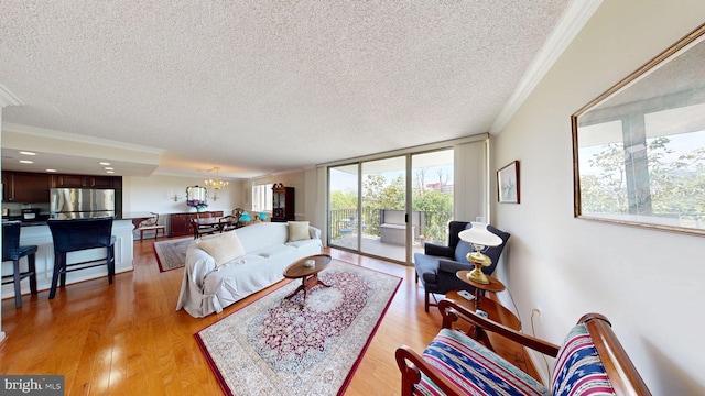 1515 S Arlington Ridge Rd Unit 402, Arlington, VA 22202 - living area featuring crown molding, a textured ceiling, a chandelier, and light wood-type flooring