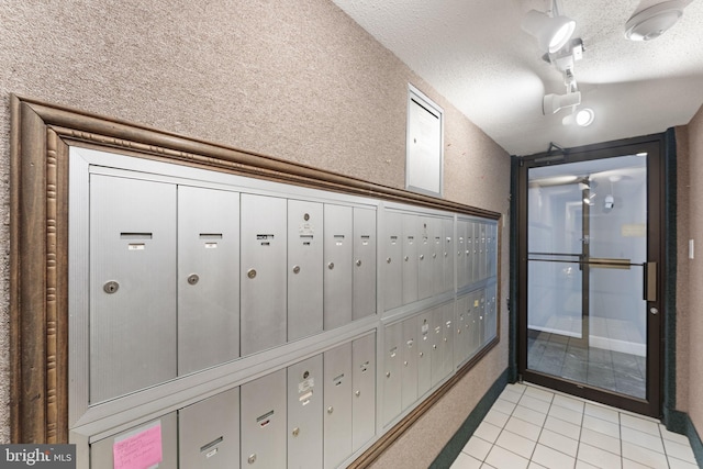 1515 S Arlington Ridge Rd Unit 402, Arlington, VA 22202 - hall with mail area, light tile patterned floors, and a textured ceiling