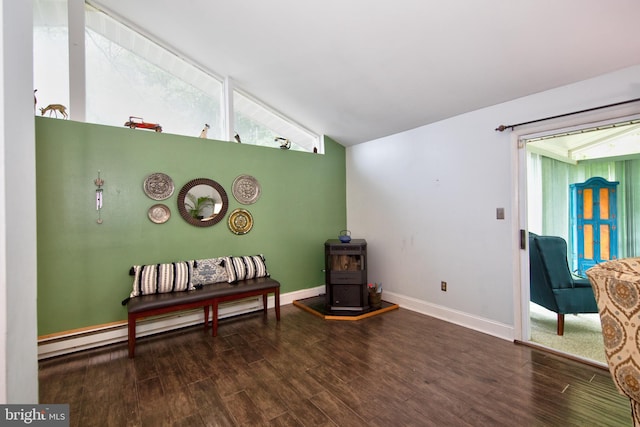 419 Breslin Rd, Joppa, MD 21085 - sitting room featuring vaulted ceiling, wood finished floors, baseboards, and a wood stove