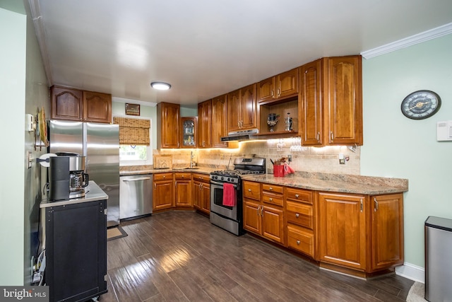 419 Breslin Rd, Joppa, MD 21085 - kitchen with stainless steel appliances, brown cabinets, dark wood-type flooring, tasteful backsplash, and light stone countertops