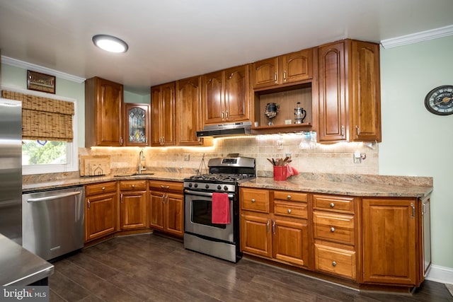 419 Breslin Rd, Joppa, MD 21085 - kitchen with stainless steel appliances, a sink, under cabinet range hood, brown cabinets, and crown molding