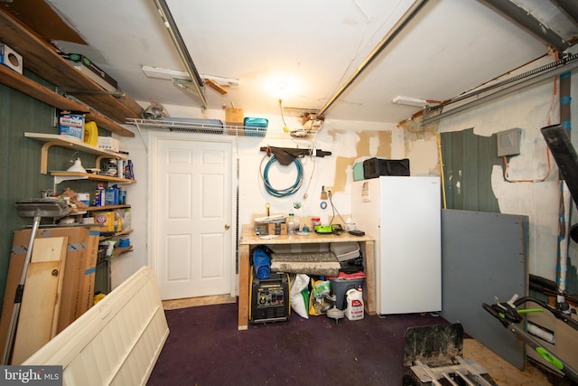 419 Breslin Rd, Joppa, MD 21085 - basement with freestanding refrigerator, a workshop area, and a garage