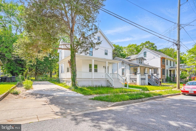 4016 35th St, Mount Rainier, MD 20712 - view of front of home with a porch, a residential view, and driveway