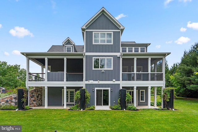 13492 Allnutt Ln, Highland, MD 20777 - rear view of house with a sunroom, a patio area, a lawn, and french doors