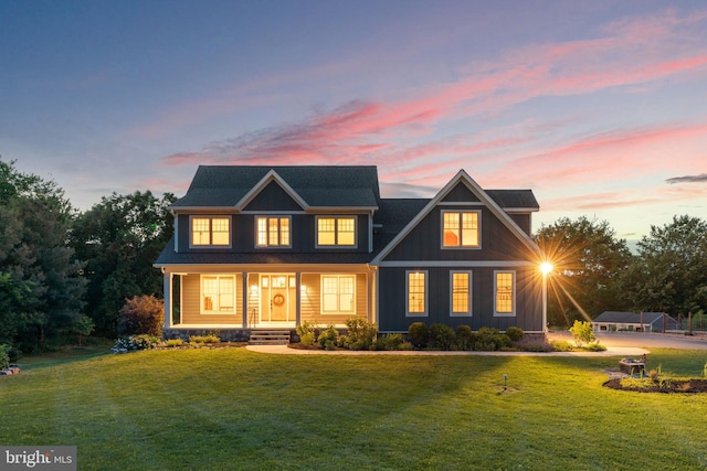 13492 Allnutt Ln, Highland, MD 20777 - view of front facade featuring a lawn, a porch, and board and batten siding