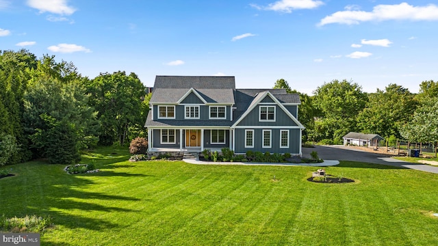 13492 Allnutt Ln, Highland, MD 20777 - shingle-style home featuring a porch, a front lawn, and asphalt driveway