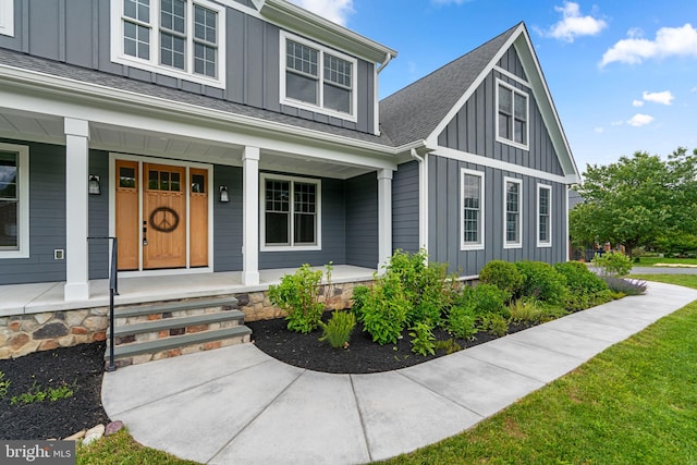 13492 Allnutt Ln, Highland, MD 20777 - view of front of property with board and batten siding, a porch, and roof with shingles