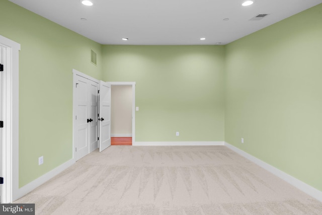13492 Allnutt Ln, Highland, MD 20777 - spare room featuring light colored carpet, baseboards, and recessed lighting