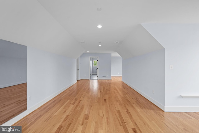 13492 Allnutt Ln, Highland, MD 20777 - additional living space with light wood-type flooring, lofted ceiling, baseboards, and recessed lighting