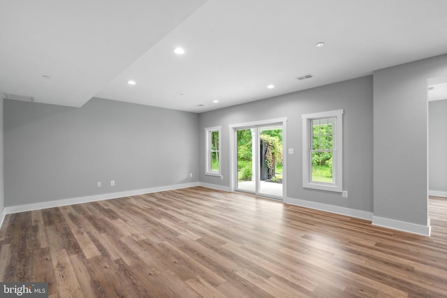 13492 Allnutt Ln, Highland, MD 20777 - unfurnished living room featuring recessed lighting, baseboards, and light wood-type flooring