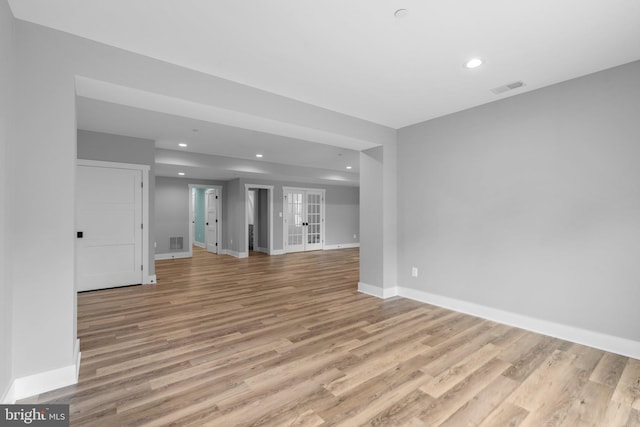 13492 Allnutt Ln, Highland, MD 20777 - unfurnished room with light wood-style flooring, baseboards, recessed lighting, and french doors