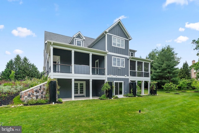 13492 Allnutt Ln, Highland, MD 20777 - rear view of property featuring a sunroom, board and batten siding, french doors, and a patio