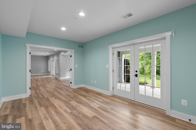 13492 Allnutt Ln, Highland, MD 20777 - unfurnished room featuring french doors, baseboards, light wood-style floors, and recessed lighting