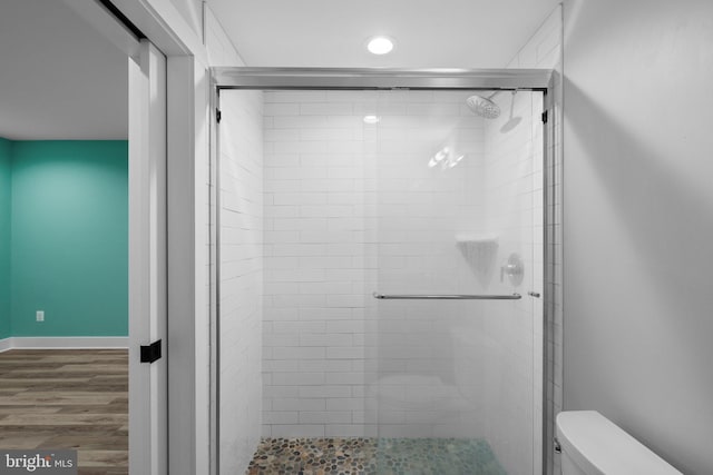 13492 Allnutt Ln, Highland, MD 20777 - bathroom featuring toilet, a stall shower, wood finished floors, and recessed lighting