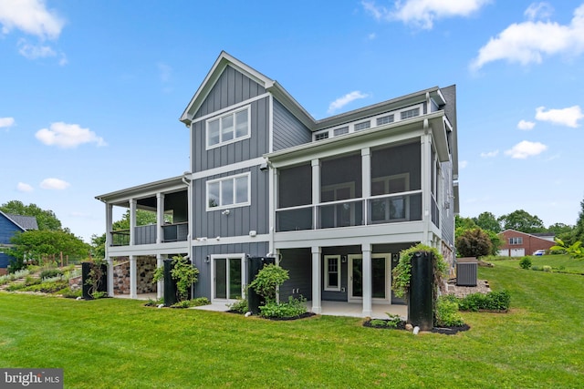 13492 Allnutt Ln, Highland, MD 20777 - back of house with board and batten siding, a patio, a sunroom, and central air condition unit