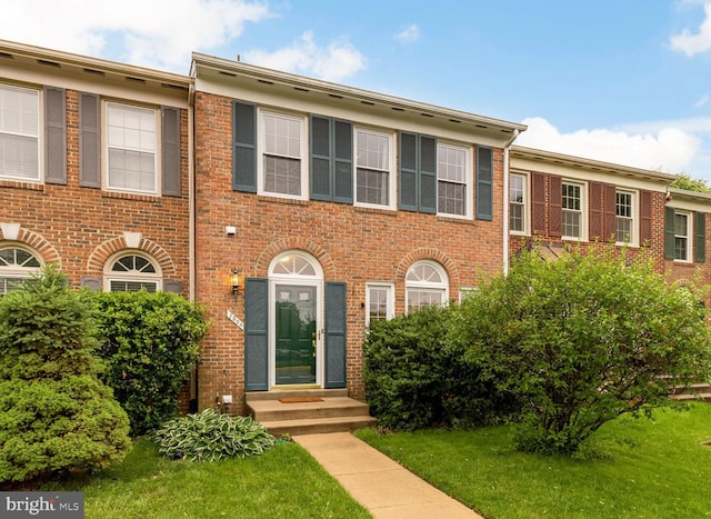 7504 Oldham Way, Alexandria, VA 22315 - view of front facade with entry steps, brick siding, and a front lawn