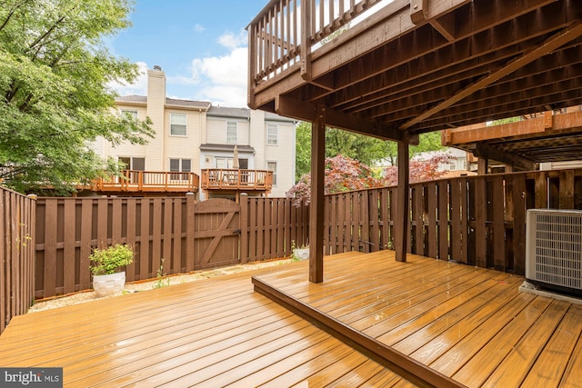 7504 Oldham Way, Alexandria, VA 22315 - wooden terrace featuring central AC unit and a gate