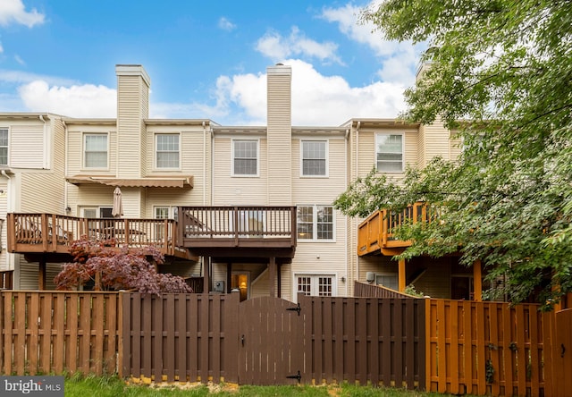 7504 Oldham Way, Alexandria, VA 22315 - rear view of property featuring a gate, a deck, and a chimney