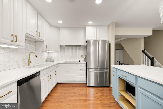 7504 Oldham Way, Alexandria, VA 22315 - kitchen featuring appliances with stainless steel finishes, a sink, white cabinets, light countertops, and recessed lighting