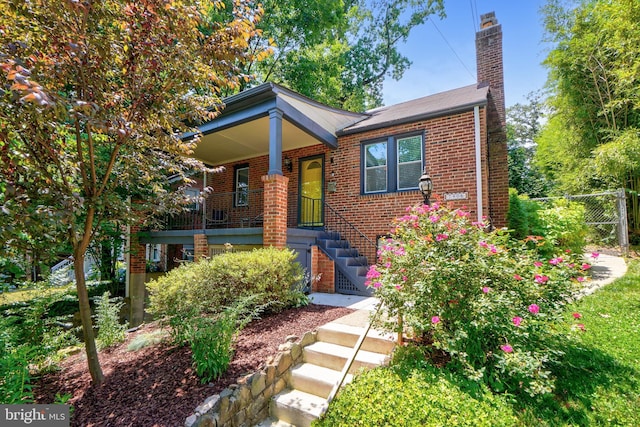 7906 Garland Ave, Takoma Park, MD 20912 - view of front of home with a chimney and brick siding