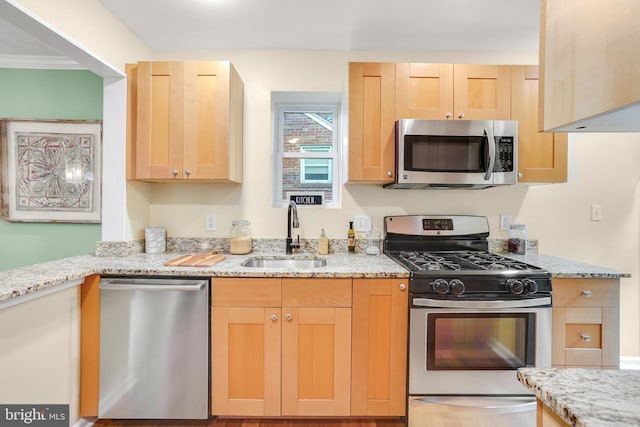 7906 Garland Ave, Takoma Park, MD 20912 - kitchen with appliances with stainless steel finishes, a sink, light brown cabinets, and light stone countertops