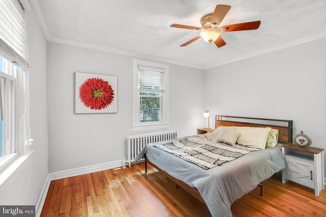 7906 Garland Ave, Takoma Park, MD 20912 - bedroom with radiator heating unit, light wood-type flooring, baseboards, crown molding, and a ceiling fan