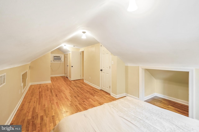 7906 Garland Ave, Takoma Park, MD 20912 - bonus room featuring light wood-type flooring, vaulted ceiling, baseboards, and a wall mounted AC