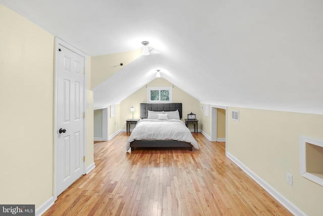 7906 Garland Ave, Takoma Park, MD 20912 - bedroom with light wood-style floors, lofted ceiling, and baseboards