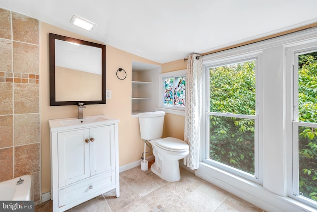 7906 Garland Ave, Takoma Park, MD 20912 - full bath with vanity, toilet, baseboards, and a bathtub