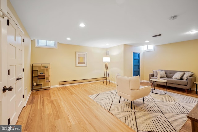 7906 Garland Ave, Takoma Park, MD 20912 - living room featuring a baseboard heating unit, light wood-type flooring, plenty of natural light, baseboards, and recessed lighting