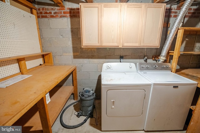 27 Holcumb Ct, Baltimore, MD 21220 - laundry room featuring washing machine and clothes dryer, concrete block wall, and cabinet space