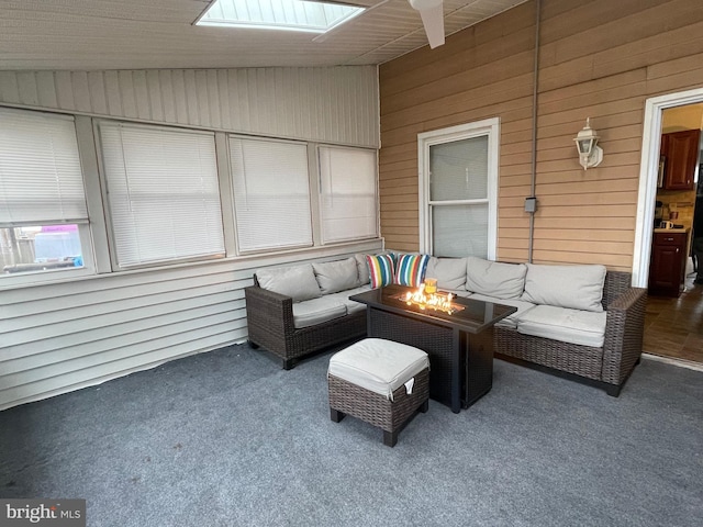 27 Holcumb Ct, Baltimore, MD 21220 - sunroom / solarium with vaulted ceiling, an outdoor living space with a fire pit, a skylight, and a ceiling fan